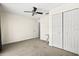 Spacious bedroom with a ceiling fan, neutral carpet, and a double-door closet at 406 116Th E St, Bradenton, FL 34212