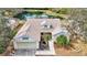 A charming home exterior with a well-manicured lawn and a tranquil water feature at 406 116Th E St, Bradenton, FL 34212