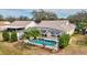 A refreshing screened-in pool with tropical landscaping at 406 116Th E St, Bradenton, FL 34212