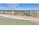 Beautiful aerial view of condos and a sandy beach with turquoise waters at 4390 Exeter Dr # I305, Longboat Key, FL 34228