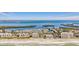 Aerial shot of beachfront condos with serene waters and beautiful scenery at 4390 Exeter Dr # I305, Longboat Key, FL 34228