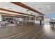 Spacious banquet room with hardwood floors, wood beams and lots of seating for community events at 4390 Exeter Dr # I305, Longboat Key, FL 34228