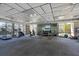 Bright gym with modern equipment, mirrored walls, and serene views of the outdoors at 4390 Exeter Dr # I305, Longboat Key, FL 34228