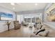 Comfortable living room with a beach-themed design and scenic outside views at 4390 Exeter Dr # I305, Longboat Key, FL 34228