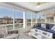 Cozy living room featuring large windows with a view of the intercoastal waterway at 4390 Exeter Dr # I305, Longboat Key, FL 34228