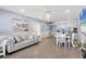 Open-concept living and dining area with modern finishes at 4390 Exeter Dr # I305, Longboat Key, FL 34228