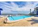 Community pool with picturesque waterfront views providing a relaxing oasis for residents at 4390 Exeter Dr # I305, Longboat Key, FL 34228