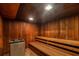 Relaxing sauna with wood paneling, benches, and heater for a tranquil experience at 4390 Exeter Dr # I305, Longboat Key, FL 34228
