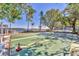 Outdoor shuffleboard court with mature landscaping and view of waterfront at 4390 Exeter Dr # I305, Longboat Key, FL 34228