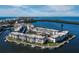 Aerial view of the condo community on a point with boat slips and waterfront access with unit #J201 marked at 4400 Exeter Dr # J-201, Longboat Key, FL 34228