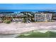 Aerial view of beachfront condos and gulf views in Longboat Key, Florida at 4400 Exeter Dr # J-201, Longboat Key, FL 34228