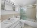 Bathroom featuring a shower with glass door, tiled walls and white vanity at 4400 Exeter Dr # J-201, Longboat Key, FL 34228