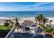 Exterior shot of beachside building with access to the beach and beautiful Gulf of Mexico views at 4400 Exeter Dr # J-201, Longboat Key, FL 34228