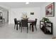 Dining room with seating for four, tile flooring, and modern decor at 4400 Exeter Dr # J-201, Longboat Key, FL 34228