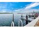 Community boat dock with ladder access for easy access to the pristine blue water of the canal at 4400 Exeter Dr # J-201, Longboat Key, FL 34228