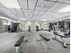 Community gym with updated equipment, fitness machines, workout benches, and bright lighting at 4400 Exeter Dr # J-201, Longboat Key, FL 34228