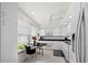Bright, modern kitchen features white cabinets, black countertops, and a small dining area by the window at 4400 Exeter Dr # J-201, Longboat Key, FL 34228