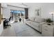 Bright living room featuring neutral colors and a view of the outside at 4400 Exeter Dr # J-201, Longboat Key, FL 34228