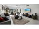 Bright living room featuring neutral colors, tile flooring, and decor at 4400 Exeter Dr # J-201, Longboat Key, FL 34228