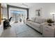 Bright living room featuring neutral colors and a view of the outside at 4400 Exeter Dr # J-201, Longboat Key, FL 34228