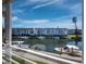 Scenic water view from a condo featuring boats docked along a canal in front of the building at 4400 Exeter Dr # J-201, Longboat Key, FL 34228