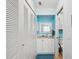 Well-maintained bathroom with white vanity, closet, and adjacent toilet area at 460 S Paula Dr # 304, Dunedin, FL 34698