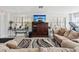 Community common room featuring couches, tables, a large tv, and an exercise bike at 460 S Paula Dr # 304, Dunedin, FL 34698