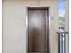 View of the elevator with a door of wood-grain texture and a metal border at 460 S Paula Dr # 304, Dunedin, FL 34698