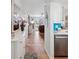 Hallway view of the kitchen, dining area, and living room at 460 S Paula Dr # 304, Dunedin, FL 34698