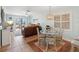 Open floor plan living area with stylish decor and patio access at 460 S Paula Dr # 304, Dunedin, FL 34698