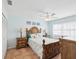 Relaxing Primary bedroom featuring tropical decor, ample natural light, and comfortable furnishings at 460 S Paula Dr # 304, Dunedin, FL 34698