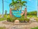 Welcome to Dunedin Causeway sign featuring lush landscaping and an inviting entrance to the community at 460 S Paula Dr # 304, Dunedin, FL 34698