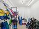 Organized storage room equipped with shelves and hooks for efficient management of beach gear and household items at 460 S Paula Dr # 304, Dunedin, FL 34698