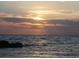Tranquil sunset over the water, featuring dramatic cloud formations and the horizon at 460 S Paula Dr # 304, Dunedin, FL 34698