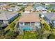 Aerial view showcases a beautiful home with a screened-in pool and meticulously landscaped yard at 4609 Antrim Dr, Sarasota, FL 34240