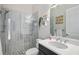 Modern bathroom featuring stylish vanity, elegant mirror, sleek glass shower, and decorative accents at 4609 Antrim Dr, Sarasota, FL 34240