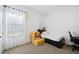 Bedroom with twin bed, study area, and abundant natural light at 4609 Antrim Dr, Sarasota, FL 34240