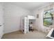 Bright bedroom with a lofted bed, study area, and natural light at 4609 Antrim Dr, Sarasota, FL 34240