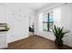 Sunlit dining area with hardwood floors, large window, and modern decor at 4609 Antrim Dr, Sarasota, FL 34240