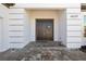 Elegant home entrance featuring a double front door with a decorative wreath and paved walkway at 4609 Antrim Dr, Sarasota, FL 34240