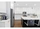 Well-appointed kitchen includes modern appliances, a spacious island, and elegant white cabinetry at 4609 Antrim Dr, Sarasota, FL 34240