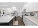 Modern kitchen featuring stainless steel appliances, a mosaic backsplash, and a spacious island at 4609 Antrim Dr, Sarasota, FL 34240