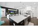 Open concept kitchen with island, adjacent living room, and stainless steel appliances at 4609 Antrim Dr, Sarasota, FL 34240