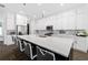 Stylish kitchen showcases a large island with seating, quartz countertops, and ample cabinet space at 4609 Antrim Dr, Sarasota, FL 34240