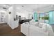 Open concept living area features hardwood flooring, modern lighting and access to the outdoor patio at 4609 Antrim Dr, Sarasota, FL 34240