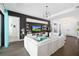 Stylish living room features hardwood flooring, a tray ceiling, and modern built in shelving at 4609 Antrim Dr, Sarasota, FL 34240