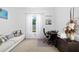 Home office with couch, desk, and natural light creating a productive workspace at 4609 Antrim Dr, Sarasota, FL 34240