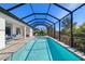 A luxurious screened-in pool and lounge area, perfect for relaxation and entertaining at 4609 Antrim Dr, Sarasota, FL 34240