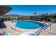 Community pool with safety features, poolside seating, and well maintained surrounding patio at 5315 11Th Street E Cir # 5315, Bradenton, FL 34203