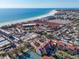 Aerial view of community near the beach showcasing residences, community features, and proximity to the ocean at 6263 Midnight Pass Rd # 105, Sarasota, FL 34242